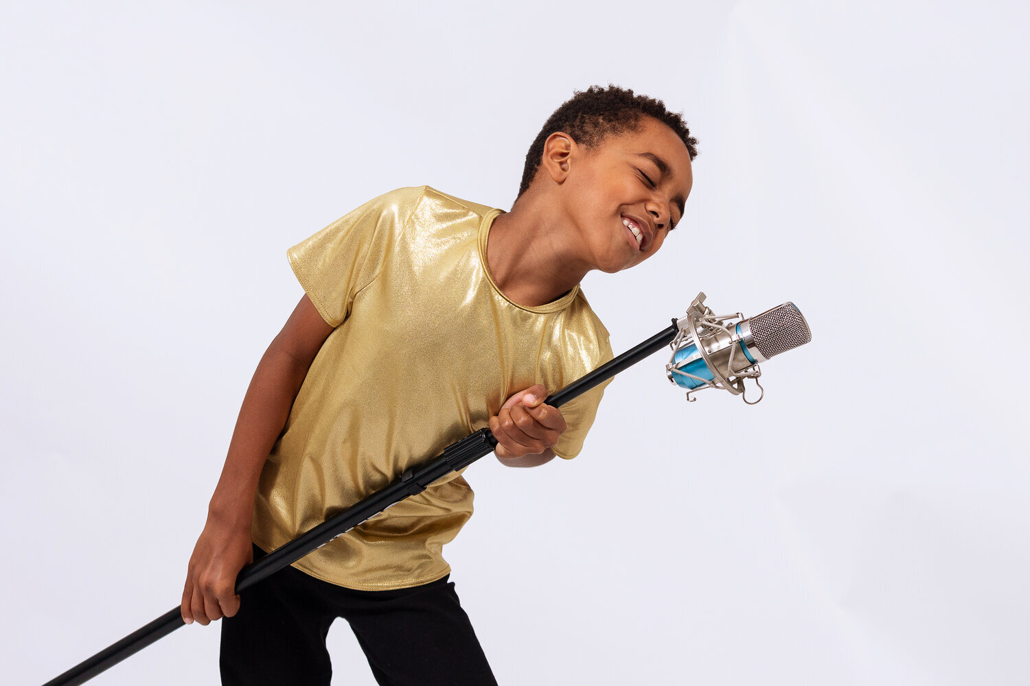 Young musician singing with a guitar